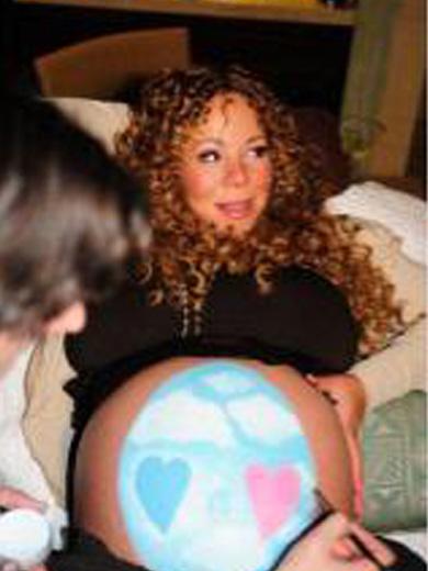 Mariah Carey pintou um ovo de páscoa a barriga e posta foto no Twitter
